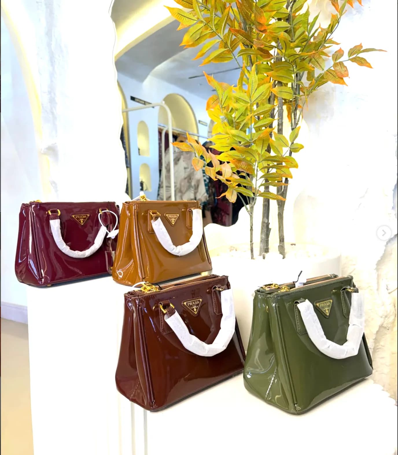 Four glossy mini bags in jewel tones